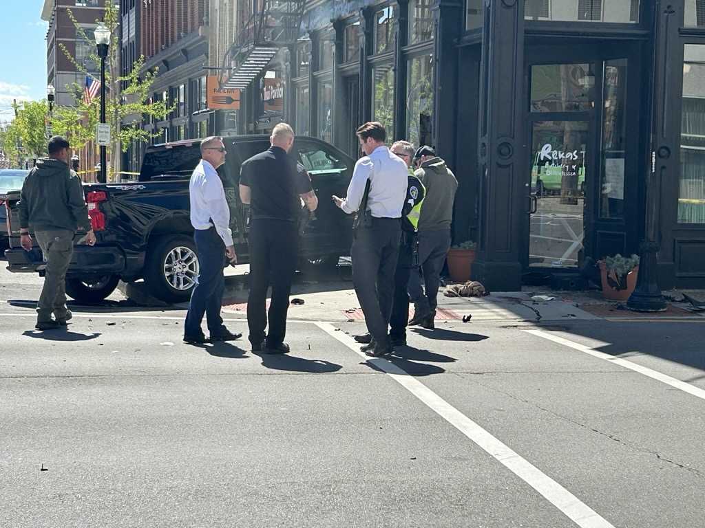 Crash in Covington sends 2 to hospital, leaves butcher shop damaged