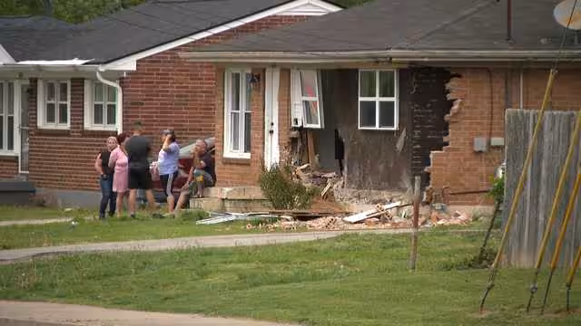 LMPD: Woman dies after crashing into home on Cooper Chapel Road